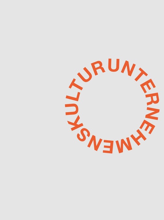 Grafik: Der Begriff "KULTURUNTERNEHMEN" ist in einem Kreis angeordnet. Der Text ist in einem warmen Rotton auf einem hellgrauen Hintergrund dargestellt.